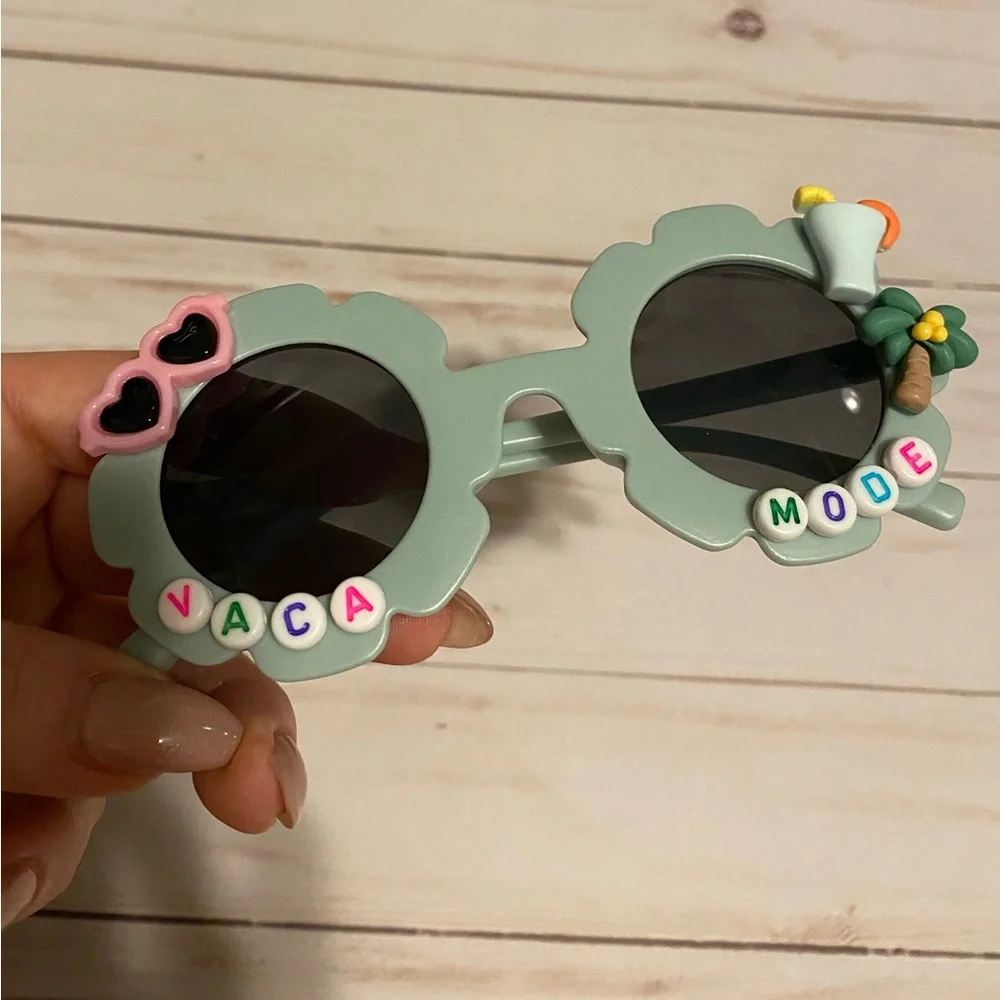 Girls greyish sunglasses w charms